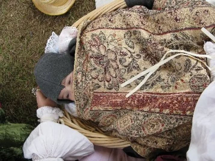 Tori in a basket as a baby